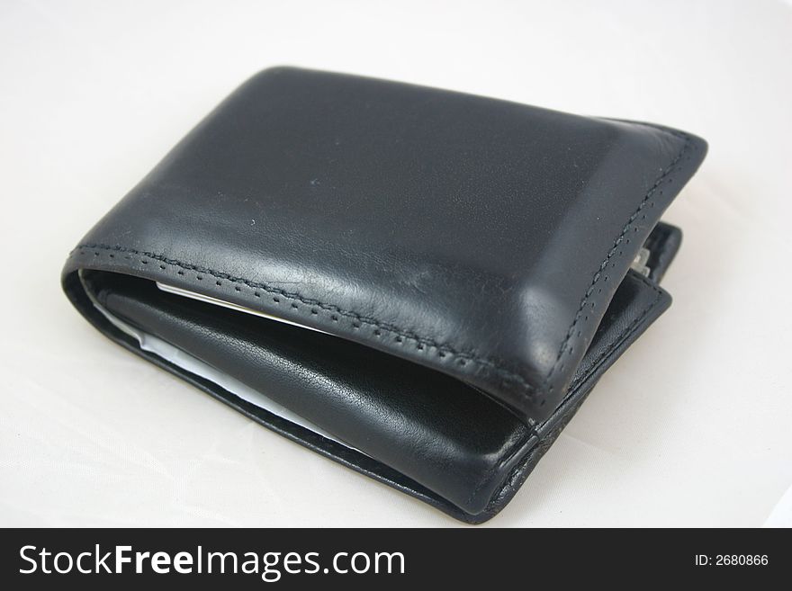 Mans wallet on a white background. Finance and business image. Mans wallet on a white background. Finance and business image.
