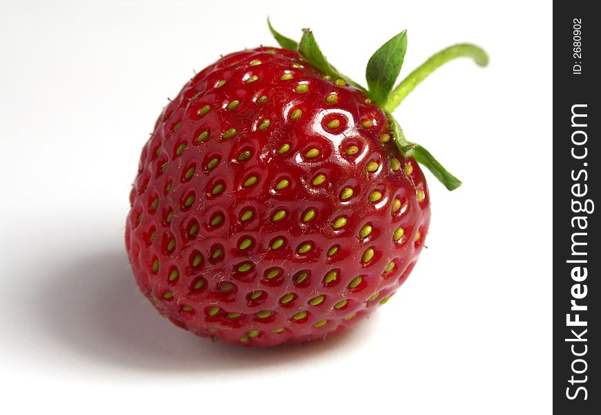 One strawberry on the white background