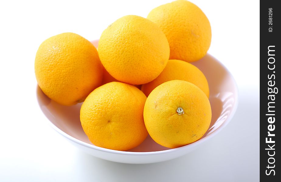 Orange fruits in white bowl. Orange fruits in white bowl