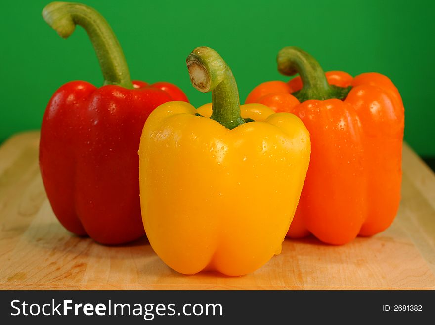 Colorful Bell Peppers with Green Background
