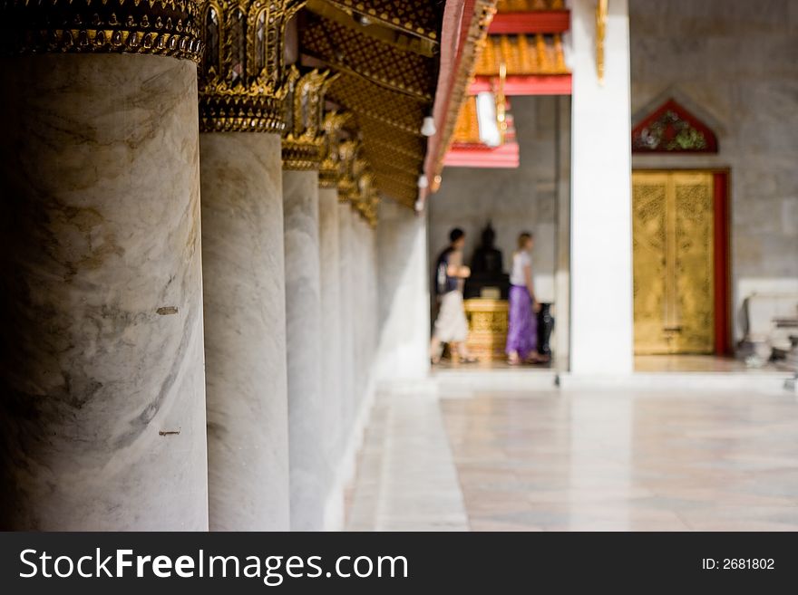 Tourists visiting a Thai Buddhist temple, Bangkok Thailand. Tourists visiting a Thai Buddhist temple, Bangkok Thailand