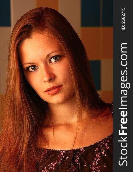 Portrait of the beautiful young woman with long hair and green eyes. Portrait of the beautiful young woman with long hair and green eyes.