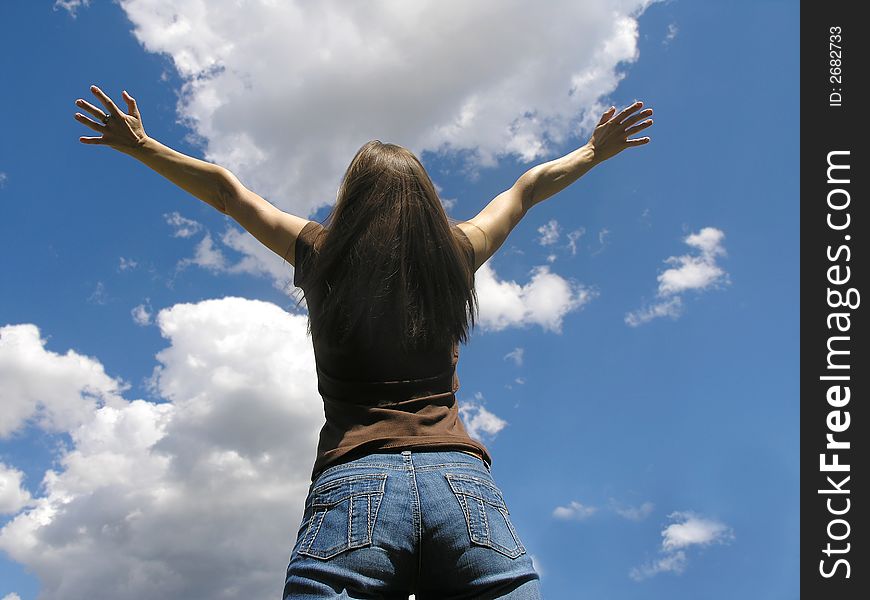 Life is beautiful .Young woman and clouds .
