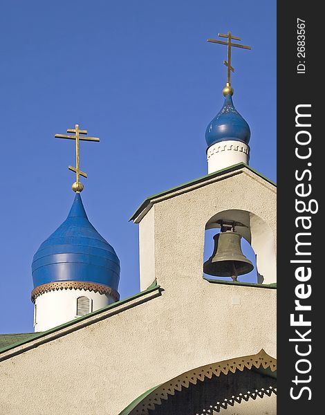 Russian church  with bell and blue towers. Russian church  with bell and blue towers.