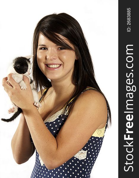 Cute girl holding a small kitten on white. Cute girl holding a small kitten on white