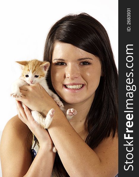 Cute girl holding a small kitten on white. Cute girl holding a small kitten on white