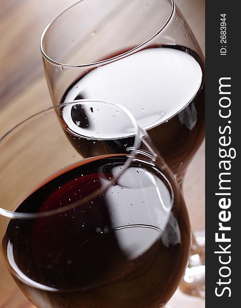 Red wine on wooden table