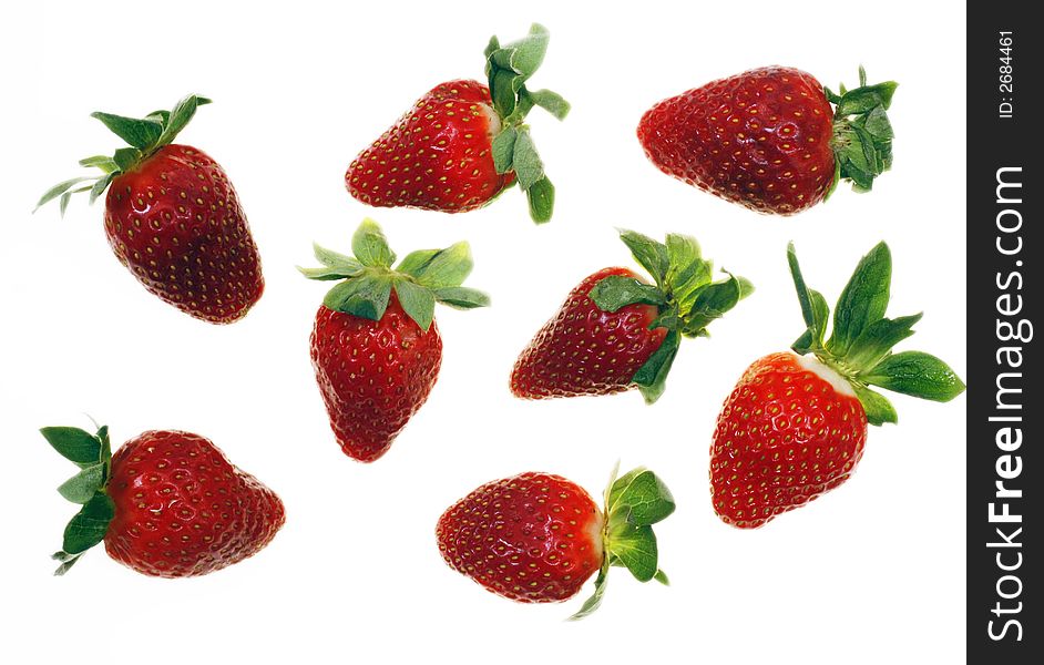 Fresh and tasty strawberries reflected on white background