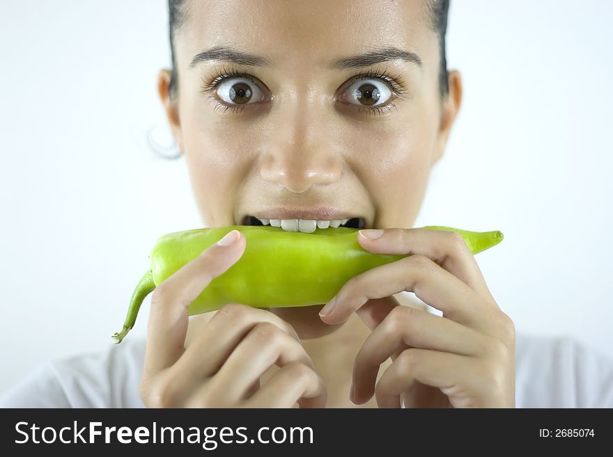 Pretty girl holding fresh green paprika. Pretty girl holding fresh green paprika