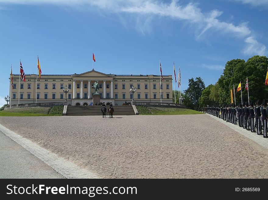 The Royal Palace in Oslo, Norway with Norwegian and Spanish flags during a Spanish state visit.