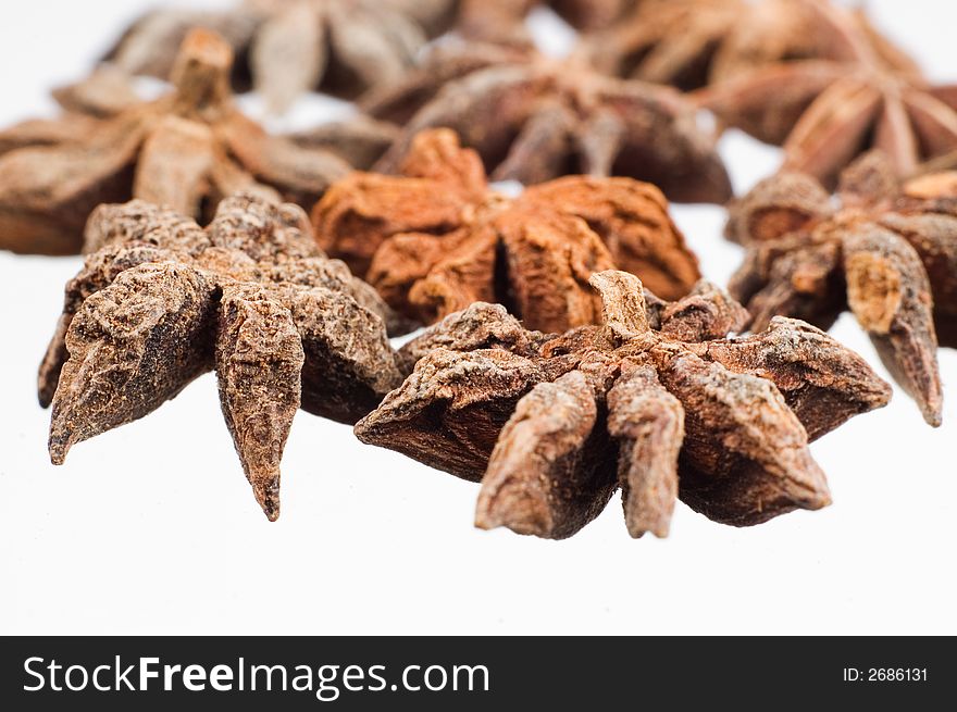 Anise stars on white background close up