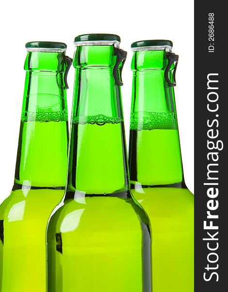 Three green beer bottles