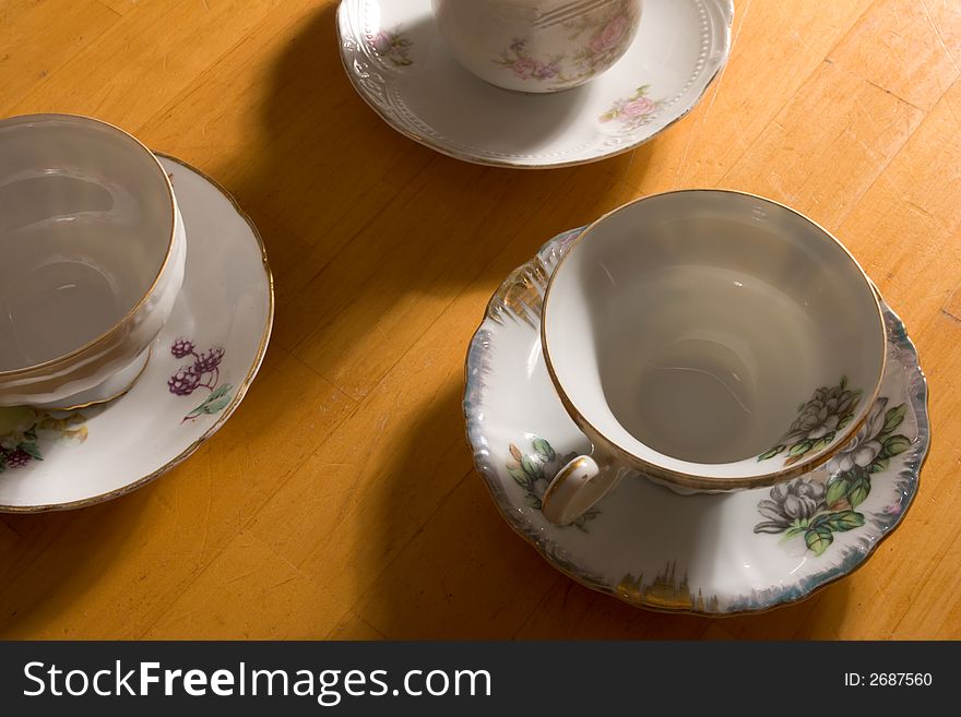 Three Teacups On Table.