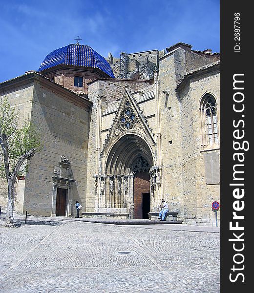 Small town colorful church Morella blue sky