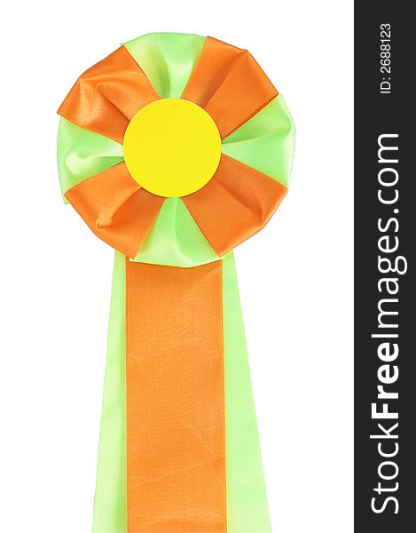 Close-up green orange award rosette. Image contains clipping path. Close-up green orange award rosette. Image contains clipping path.