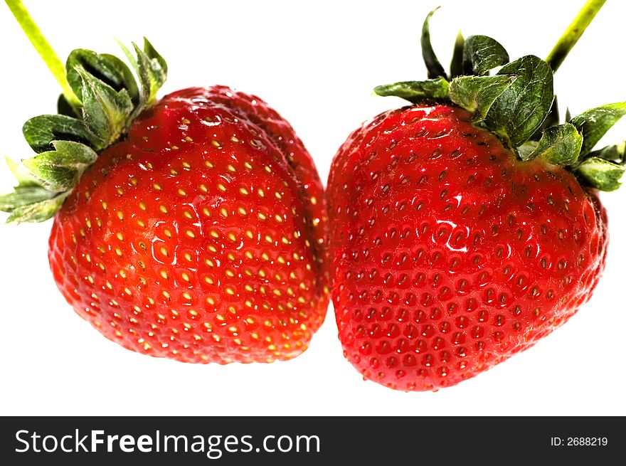 Two strawberries on a white background. Two strawberries on a white background