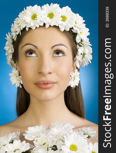 Young, beautiful and naked woman with bouquet of white flowers. White background, front view. Young, beautiful and naked woman with bouquet of white flowers. White background, front view