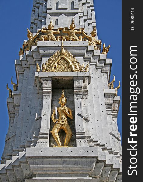 A golden statue in the grounds of the Grand Palace in Bangkok. A golden statue in the grounds of the Grand Palace in Bangkok