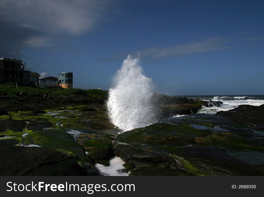 Pacific Ocean , a wave breaks against the Shore. Pacific Ocean , a wave breaks against the Shore