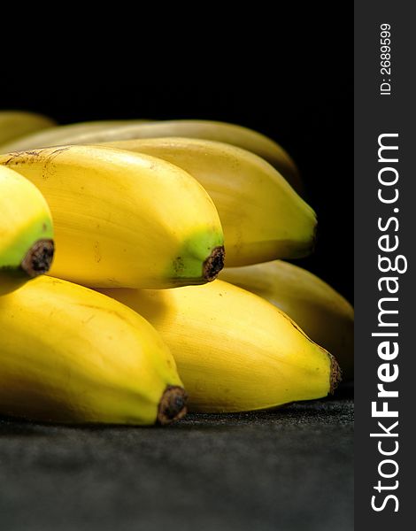 Bunch of bananas isolated on a black background. Bunch of bananas isolated on a black background