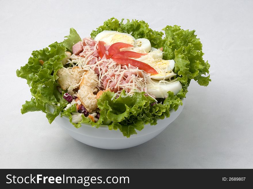 Salad with onion, olive, cheese, and other ingredients