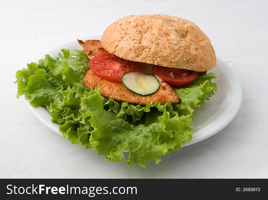 Crispy fried meat with tomato and cucumber