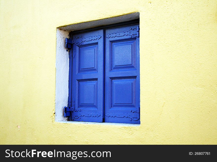 A colored greek window at santorini island