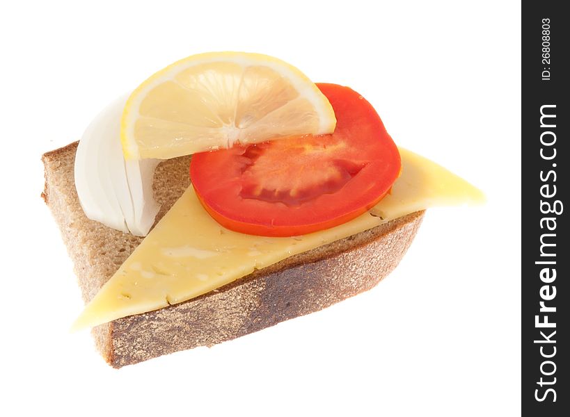 Rye-bread with cheese, tomato, onion and lemon. Isolated on a white background.