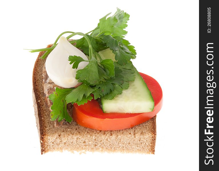 Rye-bread with tomato and canned fish. Isolated on a white background.