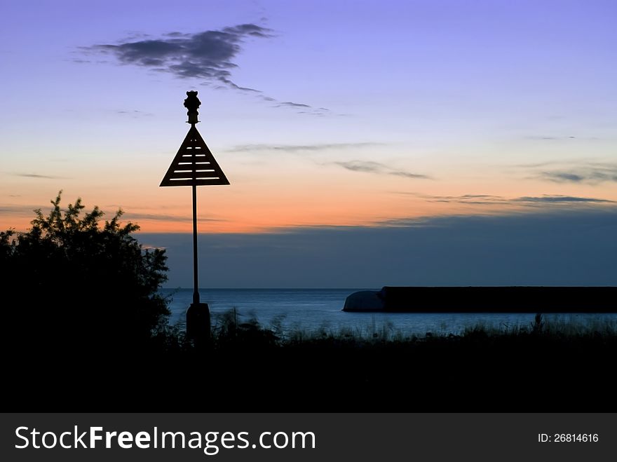 Starboard sea mark, with beautiful sunrise in background