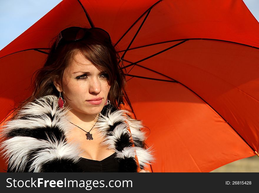 Girl with orange umbrella outdoor. Girl with orange umbrella outdoor
