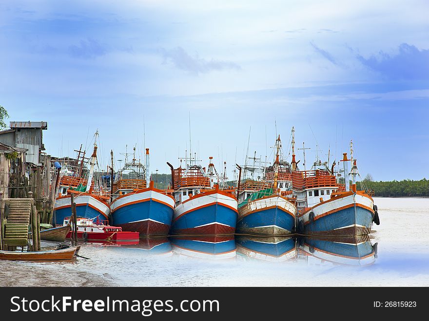 Five of fishing boats park at Pier.