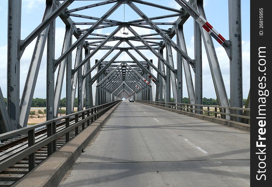 Car And Railway Iron Bridge