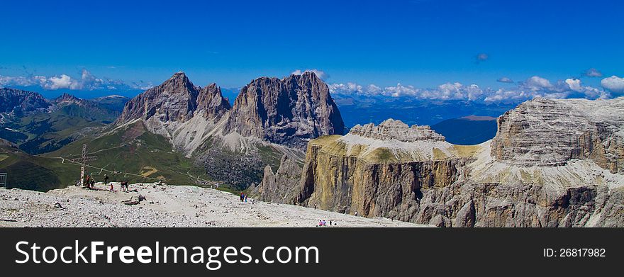 Summer view from Saas Pordoi of italian Dolomites in val di fassa with Sassolungo - Langkofel mount. Summer view from Saas Pordoi of italian Dolomites in val di fassa with Sassolungo - Langkofel mount.