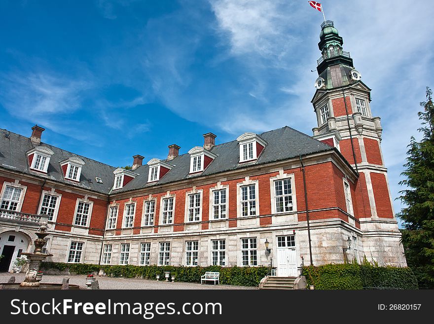 Hvedholm castle slot landmark fairy tale castle in Funen Denmark view of the main building. Hvedholm castle slot landmark fairy tale castle in Funen Denmark view of the main building