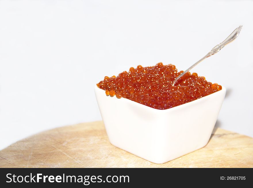 Delicious red salmon caviar with a silver spoon