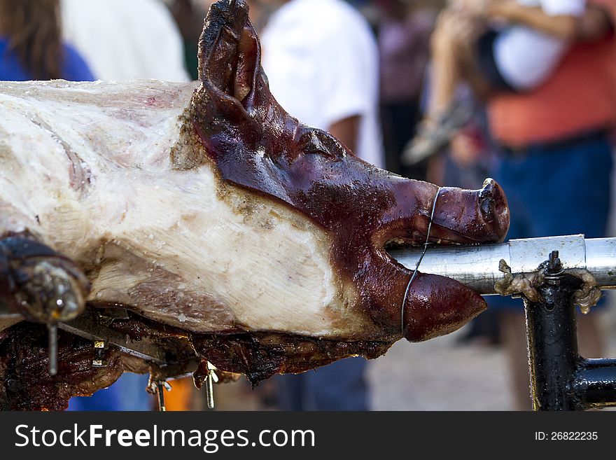 View of a roasted pig in the rack of a Medieval festival.