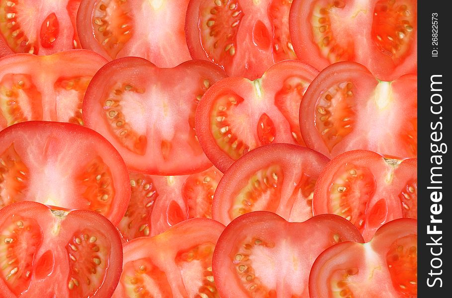 Background made from lot of freshness red sliced tomatoes. Background made from lot of freshness red sliced tomatoes