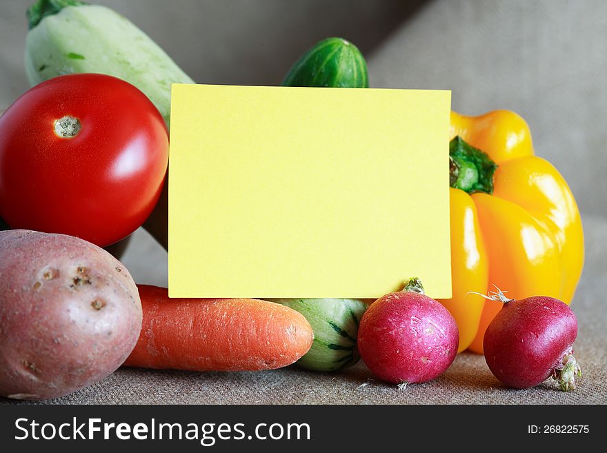 Various vegetables with blank yellow paper for recipe or menu. Various vegetables with blank yellow paper for recipe or menu