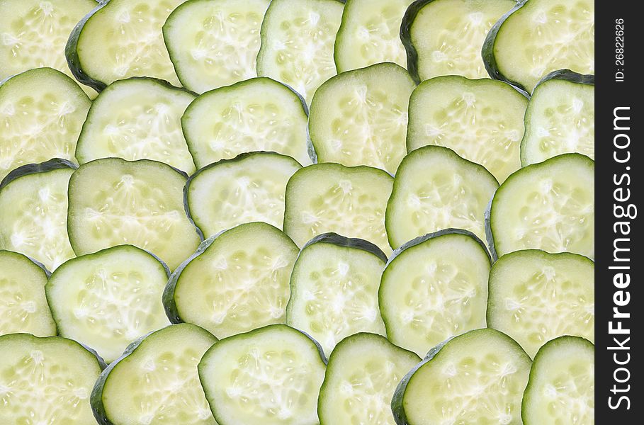 Background made from lot of freshness green sliced cucumbers. Background made from lot of freshness green sliced cucumbers