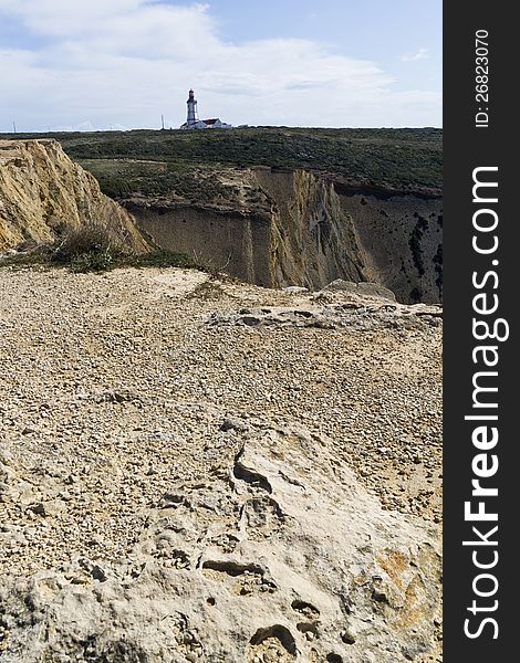 View of the beautiful lighthouse of Cape Espichel, Sesimbra, Portugal.