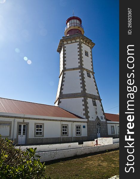 View of the beautiful lighthouse of Cape Espichel, Sesimbra, Portugal.