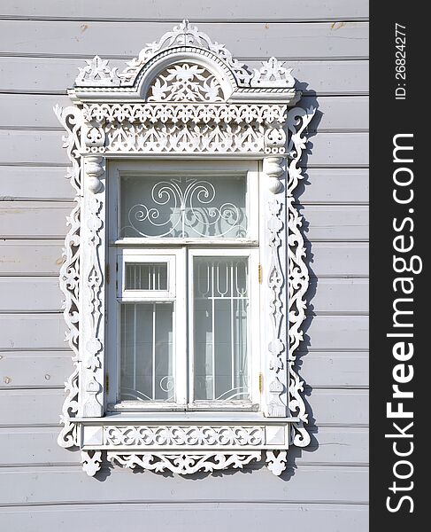 The white carved wooden window. The white carved wooden window