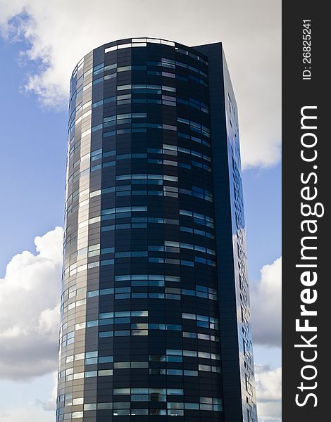 View of a beautiful and modern glass building. View of a beautiful and modern glass building.