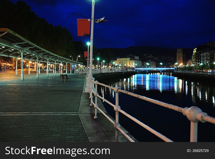 The pedestrianized riverfront in the Spanish city of Bilbao. Euskadi, Spain. The pedestrianized riverfront in the Spanish city of Bilbao. Euskadi, Spain