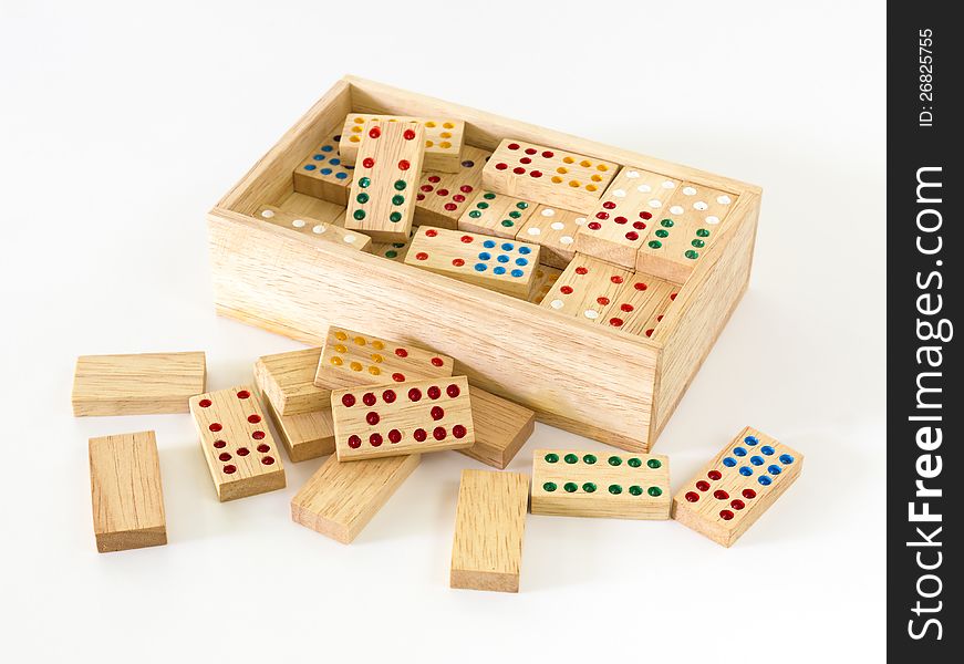 Wooden Domino in wooden box against the white background. Wooden Domino in wooden box against the white background