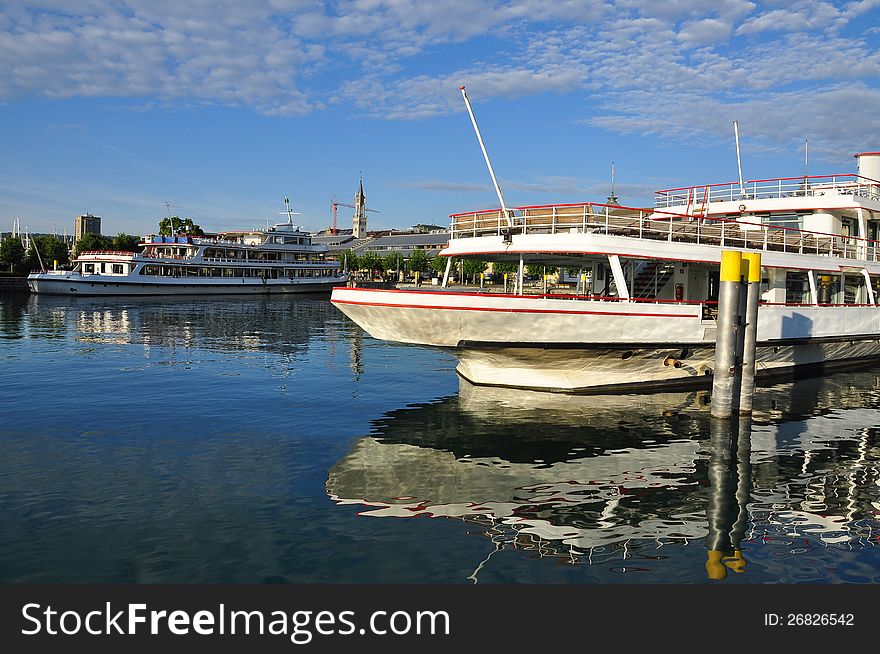 The German city of Constance. Bodensee ferryboat harbour, morning light. The German city of Constance. Bodensee ferryboat harbour, morning light.