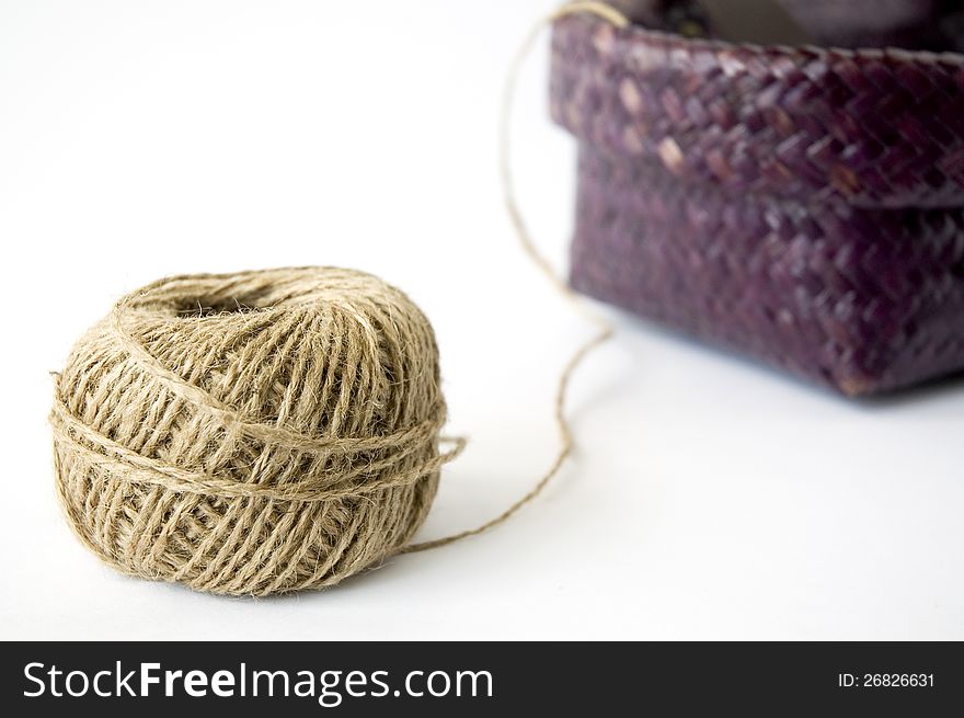 Close up ball of hemp rope with basket