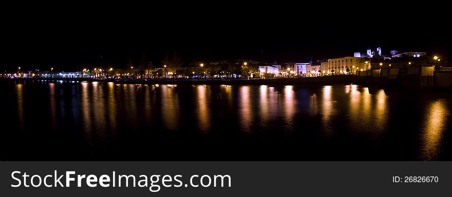 View of beautiful Tavira city in the night located in the Algarve, Portugal. View of beautiful Tavira city in the night located in the Algarve, Portugal.