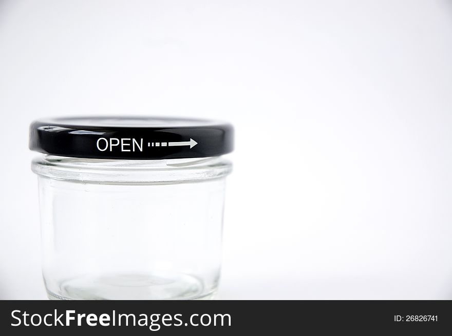 Close up text open on glass jar. Close up text open on glass jar